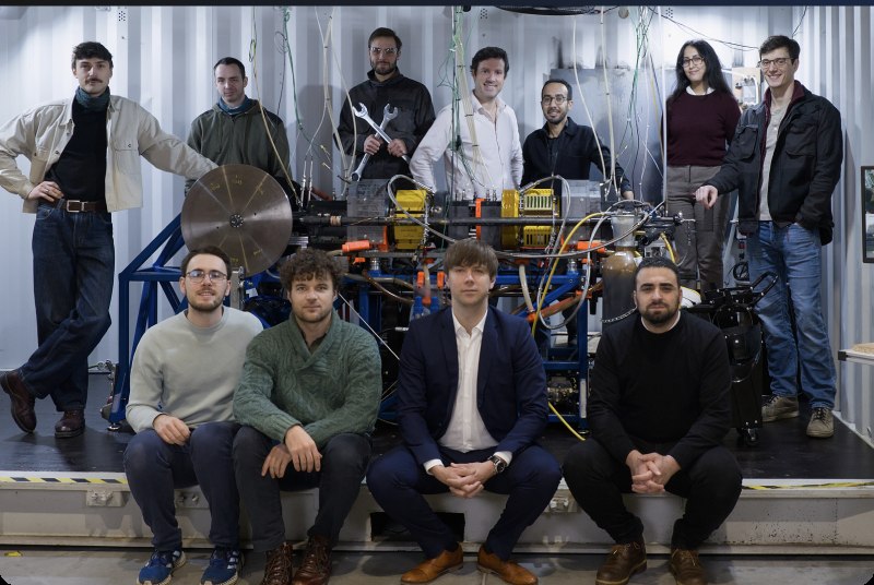 The Airthium team posed with the prototype inside the containerized test unit