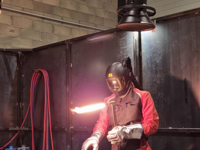 Airthium technician working with high-temperature equipment